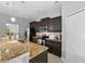 Modern kitchen with granite countertops and stainless steel appliances at 9009 Savannah Julip Ln, Orlando, FL 32832