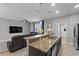 Open-concept kitchen features granite countertops, and a seamless flow to the living area at 9009 Savannah Julip Ln, Orlando, FL 32832