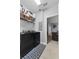 Laundry room with modern appliances and tile flooring at 9009 Savannah Julip Ln, Orlando, FL 32832