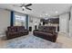 Cozy living room with comfortable seating, neutral decor and ample natural light at 9009 Savannah Julip Ln, Orlando, FL 32832