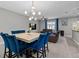Open concept living room and dining area with stylish decor and comfortable seating at 9009 Savannah Julip Ln, Orlando, FL 32832
