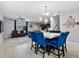 Open concept living space with tile flooring, dining table and comfortable furniture, ideal for relaxation at 9009 Savannah Julip Ln, Orlando, FL 32832