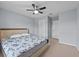 This spacious main bedroom features neutral colored walls and a ceiling fan at 9009 Savannah Julip Ln, Orlando, FL 32832