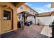Cozy outdoor patio features a gazebo and brick pavers, offering a relaxing space for entertaining at 9009 Savannah Julip Ln, Orlando, FL 32832