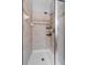 Modern shower with tiled walls, chrome fixtures, and a built-in soap dish at 9009 Savannah Julip Ln, Orlando, FL 32832