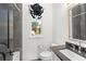 A minimalist bathroom features a sleek vanity, toilet, and a window for natural light at 9730 Lounsberry Cir, Golden Oak, FL 32836