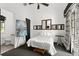Bright bedroom with white bedding, dark carpet, and unique design elements throughout the room at 9730 Lounsberry Cir, Golden Oak, FL 32836