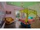 Eclectic bedroom with unique design elements, canopy bed, and colorful accents at 9730 Lounsberry Cir, Golden Oak, FL 32836