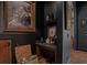 Cozy coffee bar area, complete with granite countertop, basket weave trim, and decorative elements at 9730 Lounsberry Cir, Golden Oak, FL 32836