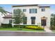 Charming two-story home with a well-manicured lawn and lush landscaping at 9730 Lounsberry Cir, Golden Oak, FL 32836