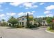 Corner lot with meticulously landscaped yard, complemented by a charming two-story home at 9730 Lounsberry Cir, Golden Oak, FL 32836