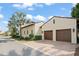 Estate home featuring a two car garage, barrel tile roof, and gorgeous palm tree at 9730 Lounsberry Cir, Golden Oak, FL 32836