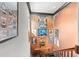 Artwork lines the walls on a stairwell, adding color to the decor at 9730 Lounsberry Cir, Golden Oak, FL 32836