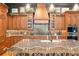 A beautifully designed kitchen is showcased with custom cabinetry and a center island at 9730 Lounsberry Cir, Golden Oak, FL 32836