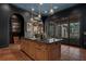 Gourmet kitchen featuring a large central island, premium appliances, and ample counter space at 9730 Lounsberry Cir, Golden Oak, FL 32836
