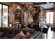 Expansive living room showcasing luxurious decor, rich wood accents, and an inviting atmosphere at 9730 Lounsberry Cir, Golden Oak, FL 32836