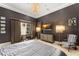 Bedroom with silver furniture, TV, carpet, and elegant lighting at 9730 Lounsberry Cir, Golden Oak, FL 32836