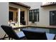 Relaxing courtyard pool area with comfortable lounge seating and views of the home's architecture at 9730 Lounsberry Cir, Golden Oak, FL 32836