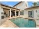 Expansive pool area offers luxurious outdoor living with a full kitchen and multiple seating areas at 9730 Lounsberry Cir, Golden Oak, FL 32836