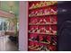 Shoe closet connected to bedroom, showcasing shelves of stylish heels and designer footwear at 9730 Lounsberry Cir, Golden Oak, FL 32836