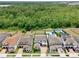 Aerial view of neighborhood homes and lots, some with pools, spas, and sports courts at 10139 Austrina Oak Loop, Winter Garden, FL 34787