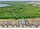 Aerial view of neighborhood homes and lots, some with pools, spas, and sports courts at 10139 Austrina Oak Loop, Winter Garden, FL 34787