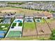 Aerial view of fenced yards with pools and a sports court at 10139 Austrina Oak Loop, Winter Garden, FL 34787
