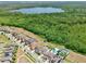 Aerial view of neighborhood homes and lots, some with pools, spas, and sports courts at 10139 Austrina Oak Loop, Winter Garden, FL 34787