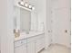 Bright bathroom with modern lighting and sleek white cabinets at 10139 Austrina Oak Loop, Winter Garden, FL 34787