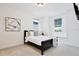Inviting bedroom with plush carpet, ample lighting, and stylish decor for a restful atmosphere at 10139 Austrina Oak Loop, Winter Garden, FL 34787