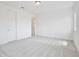Bright, spacious bedroom with plush carpet, ensuite doorway, and ample natural light at 10139 Austrina Oak Loop, Winter Garden, FL 34787