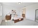 Comfortable bedroom with neutral tones, light wood accents, ensuite bathroom, and soft carpet at 10139 Austrina Oak Loop, Winter Garden, FL 34787