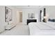 Bright primary bedroom with large artwork and black dresser at 10139 Austrina Oak Loop, Winter Garden, FL 34787