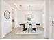 Elegant dining room with modern chandelier, stylish furniture, and contemporary decor creating a sophisticated ambiance at 10139 Austrina Oak Loop, Winter Garden, FL 34787