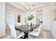 Bright dining room featuring an elegant chandelier, and modern furnishings, perfect for hosting dinner parties at 10139 Austrina Oak Loop, Winter Garden, FL 34787