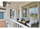Cozy front porch featuring comfortable seating and decorative plants, perfect for relaxing outdoors at 10139 Austrina Oak Loop, Winter Garden, FL 34787