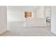 Spacious living room with modern flooring, natural light, and a convenient wet bar at 10139 Austrina Oak Loop, Winter Garden, FL 34787