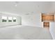 Spacious living room with modern flooring, natural light, and a convenient wet bar at 10139 Austrina Oak Loop, Winter Garden, FL 34787