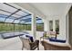 Inviting screened-in patio with comfortable seating area and view of the beautiful pool at 10139 Austrina Oak Loop, Winter Garden, FL 34787