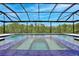 Stunning swimming pool and hot tub with a screened-in enclosure, perfect for outdoor relaxation and entertainment at 10139 Austrina Oak Loop, Winter Garden, FL 34787