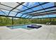 Beautiful pool and spa with a screened-in enclosure, perfect for relaxation and outdoor entertaining at 10139 Austrina Oak Loop, Winter Garden, FL 34787