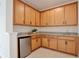Wet bar featuring granite countertops, tile flooring, stainless steel beverage cooler, and wood cabinetry at 10139 Austrina Oak Loop, Winter Garden, FL 34787