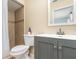 This bathroom features a shower, vanity, and toilet at 1037 Abagail Dr, Deltona, FL 32725