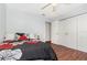 The bedroom is bright and inviting with its closet and a ceiling fan at 1037 Abagail Dr, Deltona, FL 32725