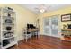Dining area with yellow walls, a ceiling fan, and an access door to a covered patio at 1037 Abagail Dr, Deltona, FL 32725