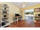 Dining area with yellow accent walls, a ceiling fan, and a sliding glass door leading to the patio at 1037 Abagail Dr, Deltona, FL 32725
