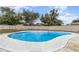 Inviting backyard pool with light concrete surround and secure, light colored fencing at 1037 Abagail Dr, Deltona, FL 32725