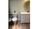 This bathroom showcases a modern vanity, an updated commode, and neutral decor at 112 Crown Oaks Way # 112, Longwood, FL 32779