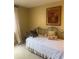 Comfortable bedroom with a daybed, soft lighting, and tasteful decor accents at 112 Crown Oaks Way # 112, Longwood, FL 32779
