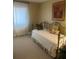 Relaxing bedroom area featuring bright natural light, simple furnishings, and a neutral palette at 112 Crown Oaks Way # 112, Longwood, FL 32779